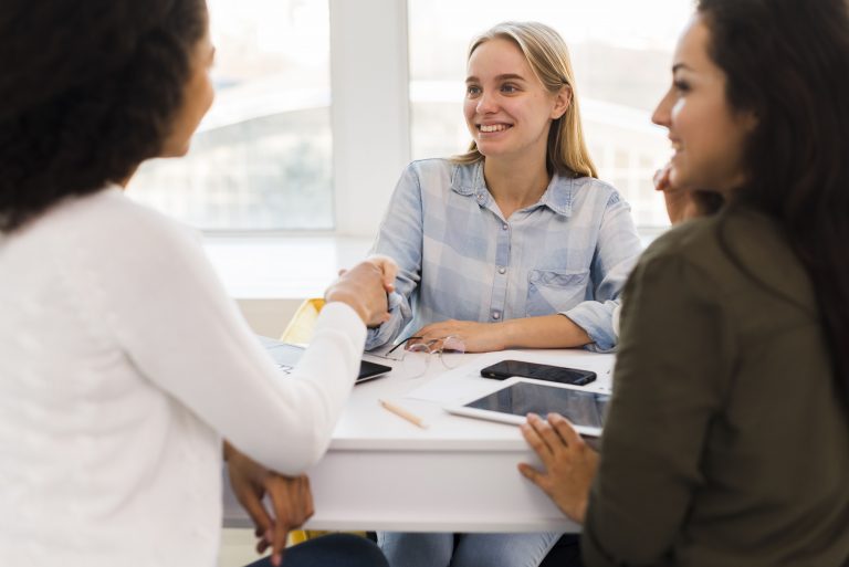 business womens shaking hands